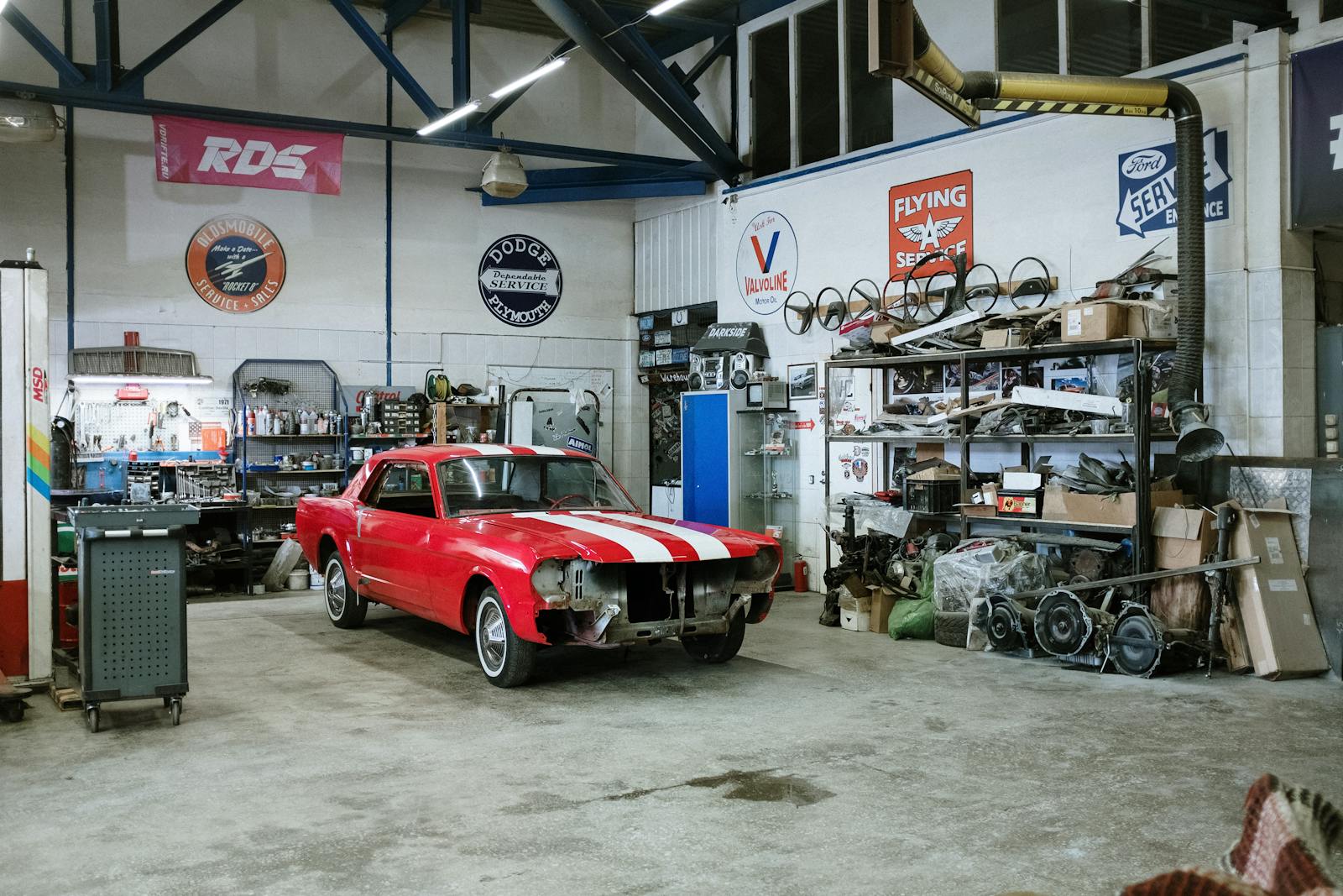 Auto repair shop website conversion - mechanic with diagnostic tablet in a Quad Cities service bay