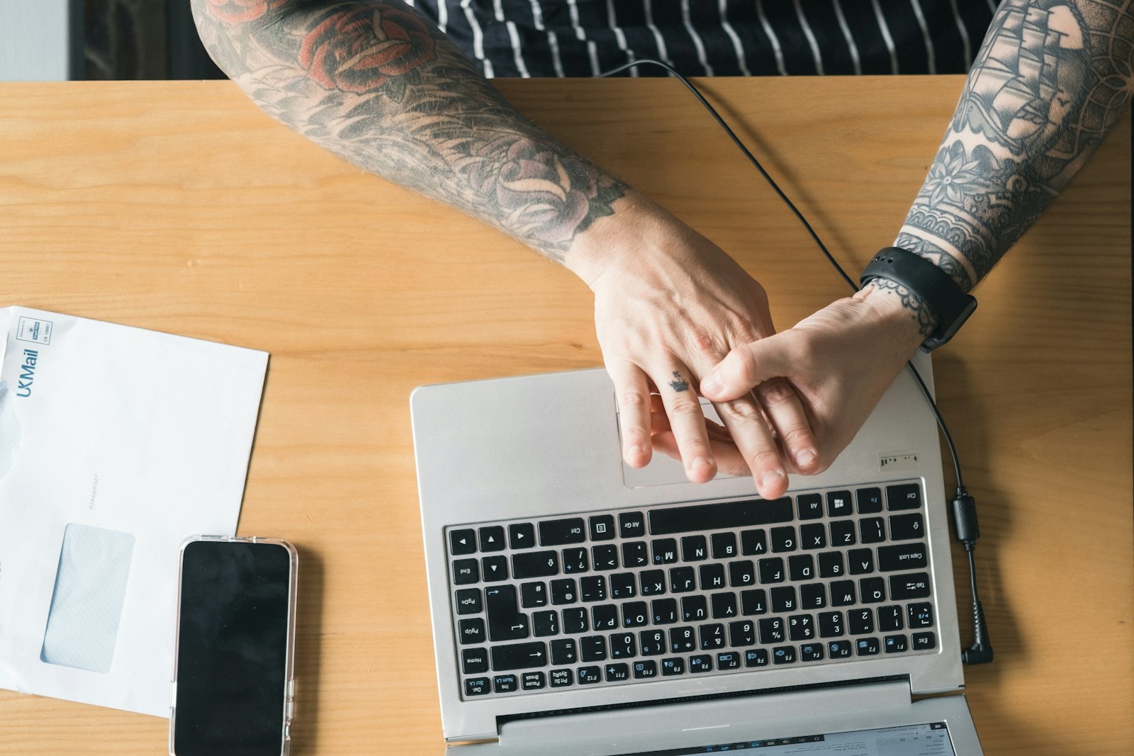 Small business owner reviewing website analytics on a laptop before deciding on a small business website redesign