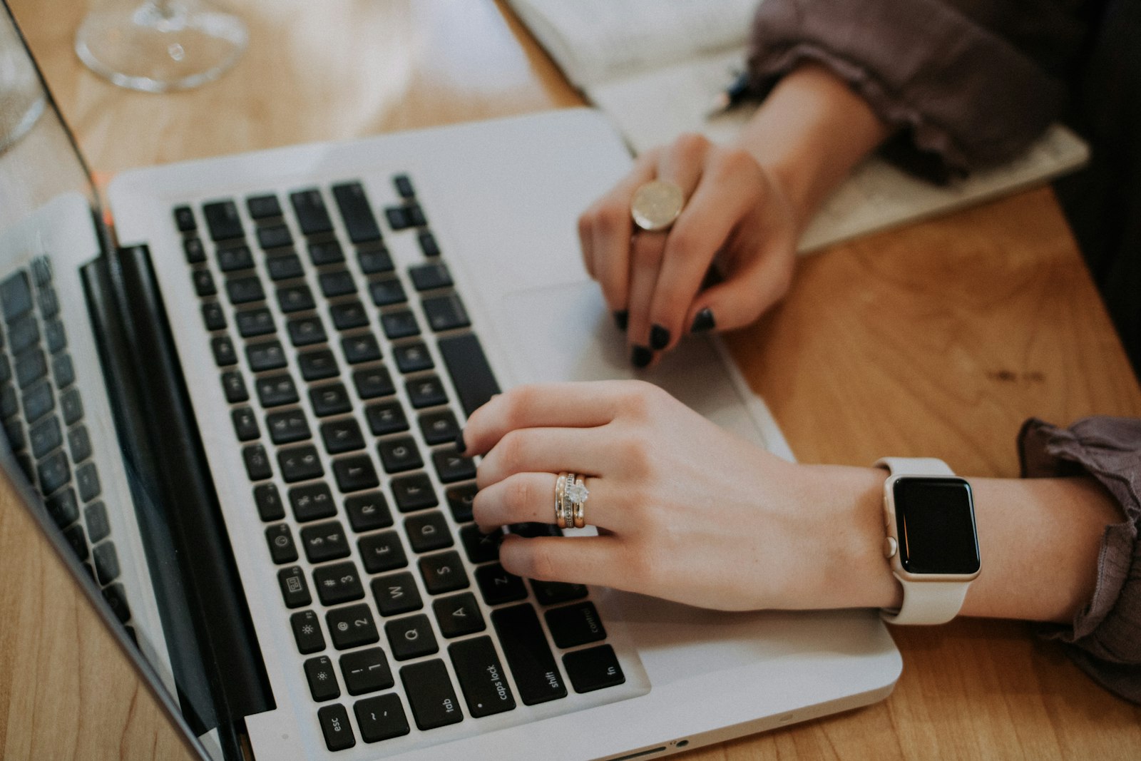 Small business owner working at a laptop, weighing whether an AI website builder will actually rank