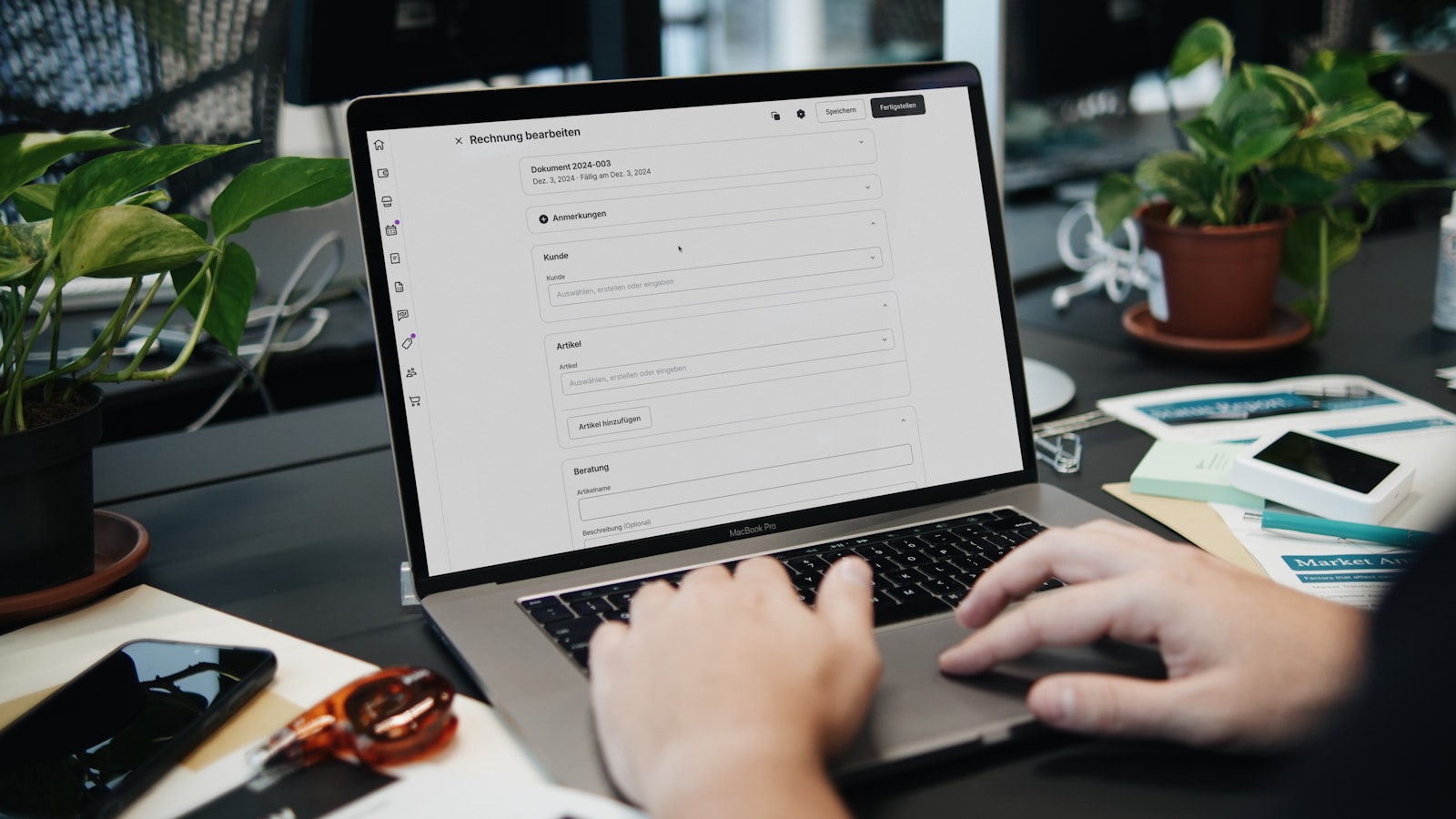 Small business owner typing on a laptop, reviewing contact form best practices on their website