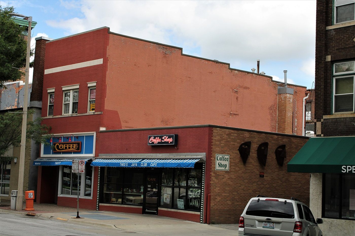Coffee shop and storefronts on a corner in downtown Rock Island, Illinois